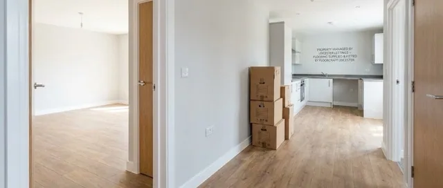 Freshly fitted rental property with light wood-effect flooring