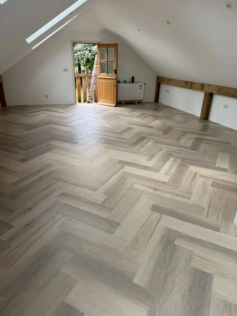 Vaulted annex with Karndean Van Gogh Texas White Ash Oak in herringbone, skylights and exposed timber beams