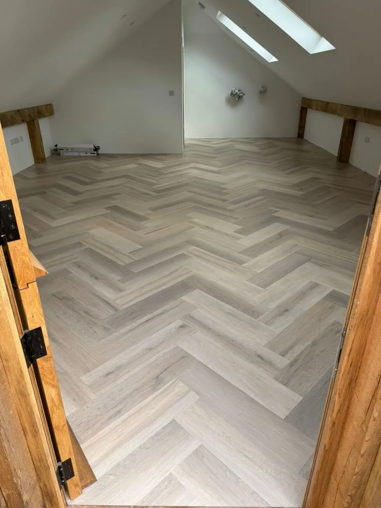 Annex herringbone flooring seen from doorway with stable door and natural light
